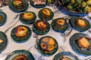 Tet tray. Full of traditional dishes. Chinese new year festival table with asian food. Vietnamese food for Tet holiday in lunar new year. Text on food meaning happy and peaceful.