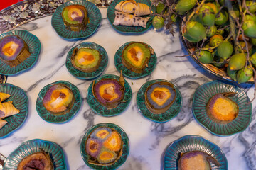 Tet tray. Full of traditional dishes. Chinese new year festival table with asian food. Vietnamese food for Tet holiday in lunar new year. Text on food meaning happy and peaceful.