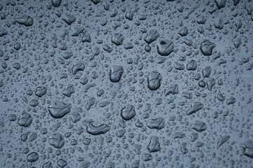  raindrops on the metallic surface in rainy days