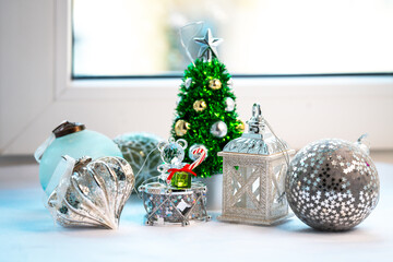 Christmas toys and a small Christmas tree on the windowsill