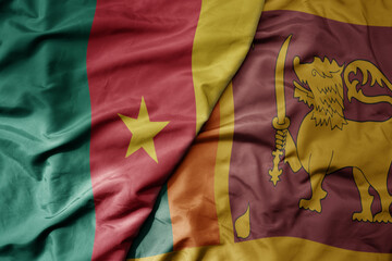 big waving national colorful flag of sri lanka and national flag of cameroon .