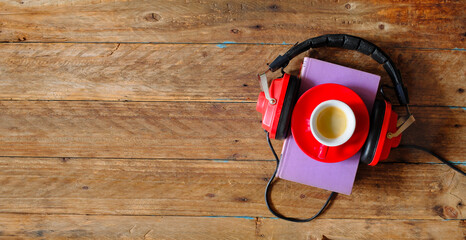 audio book concept with heap of books espresso coffee and vintage headphones, flat lay, free copy...