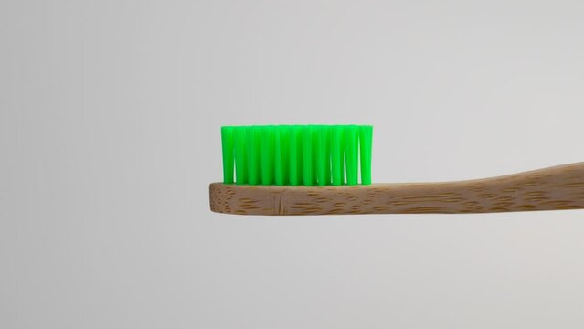 Zero waste plastic free bamboo toothbrush with green bristle close up