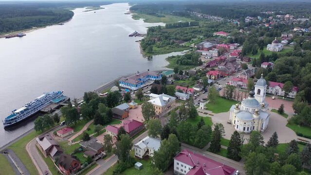Aerial panoramic view of Russian town of Myshkin on banks of Volga River on summer day overlooking Assumption Cathedral and Nikolskaya church, Yaroslavl Oblast