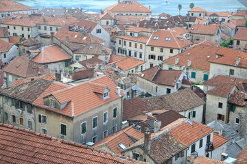 Fototapeta na wymiar Top view of the tiled roofs of the old town of Kotor, Montenegro.