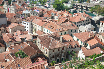 Fototapeta na wymiar Top view of the tiled roofs of the old town of Kotor, Montenegro.
