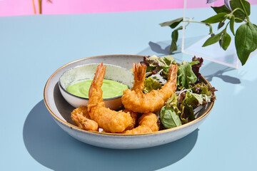 Artistic tempura shrimp with wasabi sauce, accompanied by summer blooms and soft pastel tones