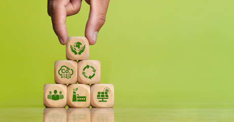 Environmental concepts on ESG, environment, carbon, recycling, society, industry and solar energy. sustainable natural energy Green icon on a wooden block. Copy space