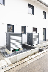 Air source Heat Pumps in front of newly built houses.