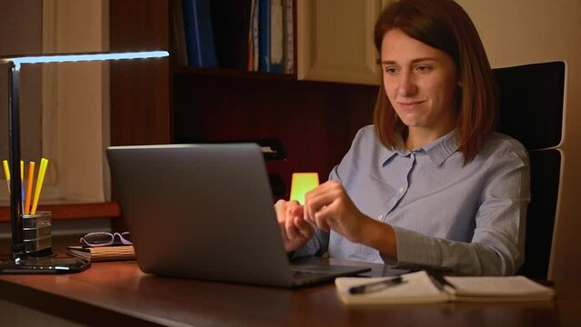 A female professional thriving in her workspace. Essence of success and enjoyment, as she navigates her tasks with remarkable efficiency. Every keystroke is a testament to her passion for her work. 