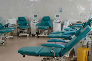 Empty and clean blood transfusion station in hospital with equipment for taking blood from donors