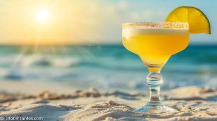  Tropical margarita cocktail with blurred beach background and copy space for text placement © Ilja