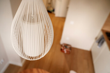 Beautiful modern white pendant lamp in the kitchen