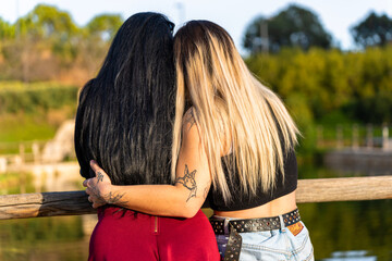 LGBT Lesbian couple hugging with love