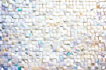 Abstract texture of white mother of pearl shell tiles