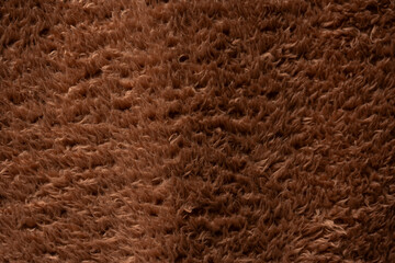 Texture of a brown faux fur as a background.
