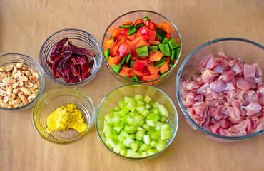 Mix of ingredients for stir fry, bell pepper, chicken fillet, chilli pepper, green tomato. Homemade fresh fried vegetables for restaurant, menu, advert or package, close up, selective focus. Top view.