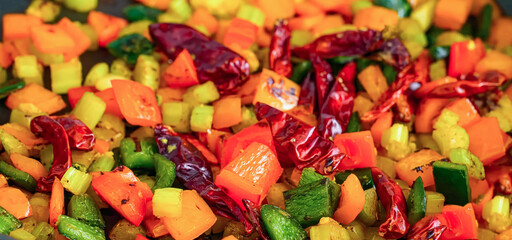Stir fry vegetables, vegetarian food, bell pepper, chilli pepper. Homemade fresh fried vegetables for restaurant, menu, advert or package, close up food background, selective focus