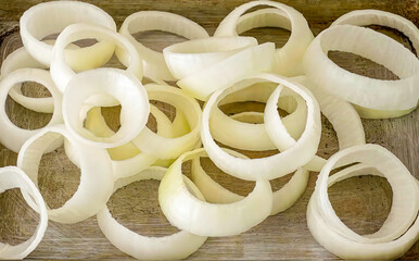 Onion rings fresh sliced. Homemade onion rings preparation for frying, food or burger ingredient for restaurant, menu, advert or package, close up selective focus. - 723253949