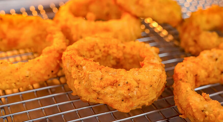 Onion rings fresh fried crunchy. Homemade onion rings for food or burger ingredient for restaurant, menu, advert or package, close up selective focus. - 723253986