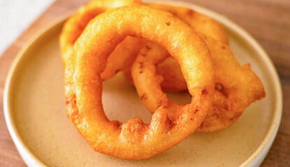 Onion rings fresh fried crunchy. Homemade onion rings for food or burger ingredient for restaurant, menu, advert or package, close up selective focus. - 723253989