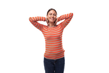 young well-groomed slender caucasian brunette woman is dressed in a striped tight-fitting orange sweater