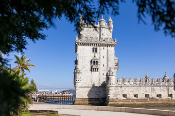Fototapeta na wymiar Belem Tower with tourists on a sunny afternoon. Belem Tower in Lisbon City, Portugal