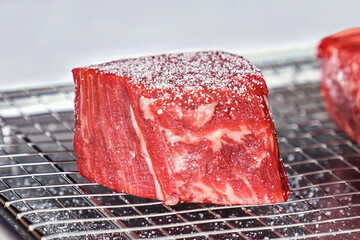 Beef steak raw fillet meat preparing for grilling. Homemade cooking beef steak, serving food for restaurant, menu, advert or package, close up, selective focus - 723255302