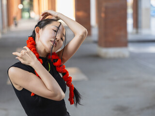 Urban dancer in oriental-inspired stretch, copy space.