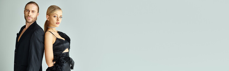 young beautiful couple in elegant outfits posing together and looking at camera, couple, banner