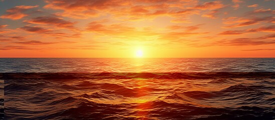 Wide panorama of beautiful sunset over calm sea.