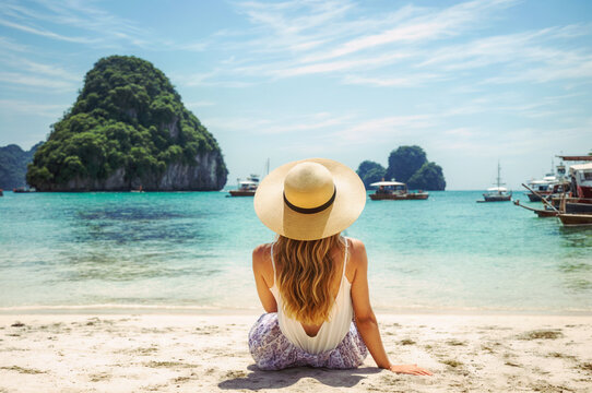 Woman enjoys tropical beach view in summer. Generative AI image