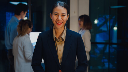 Portrait of successful executive businesswoman smart casual wear looking at camera and smiling,...