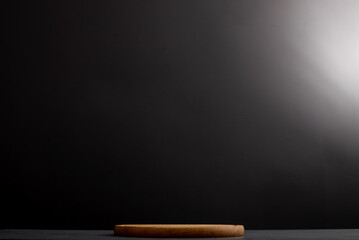 Black background with wooden pizza board