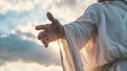 Jesus Christ in white clothes extends his hand to you against the sky as a symbol of Christianity - obrazy, fototapety, plakaty
