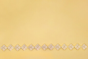 ベージュの背景でブロックを組み合わせたひし形のラインフレーム