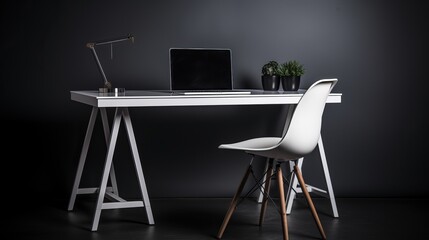 Metal desk with laptop and chair