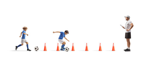 Boys at a football camp training aguility with coach