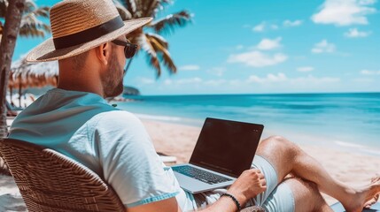 Man with Laptop at Tropical Beachside