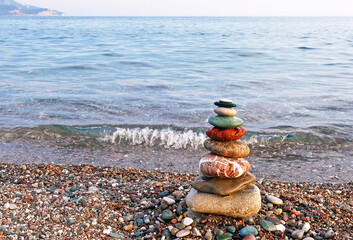 Stones balance on the beach as a concept of peace and harmony
