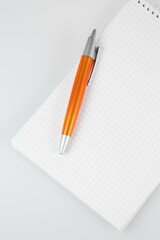 notepad and pencil, notebook and pen, notebook and pencil