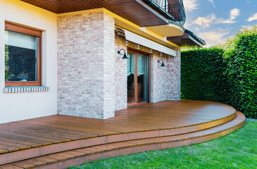 Luxury villa exterior with garden terrace and wooden exotic floor. - 723320762
