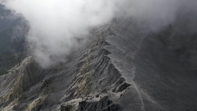 Cloudy Olympus mount aerial landscape cinematic footage. This footage is made with a dji mini 3 pro, this is a nature landscape cloudy footage of an Olympus peaks made in the day 