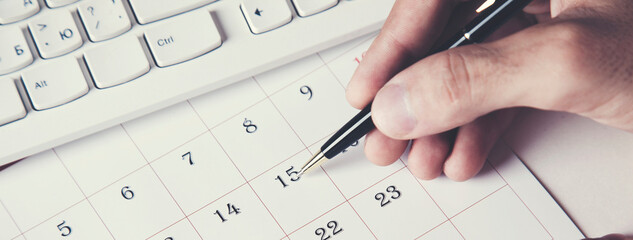 businessman's hand using calendar