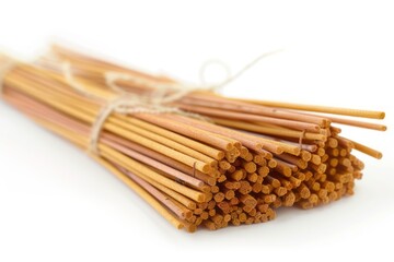 Multiple scented incense sticks joined by twine on a white surface