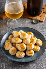 Savory buttery onion and glass of beer on the table.