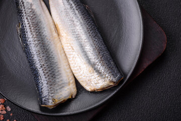 Pacific herring fillet marinated with salt, spices and herbs