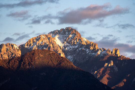 Sunset at snowcapped mount Grigna at lake Como