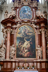 St. Stephen's Cathedral in Passau, painting behind an altar, famous baroque bishop's church in summer with a blue sky, Passau, Lower Bavaria, Germany