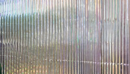 iridescent silver holographic chrome background and texture of polycarbonate plastic showcasing its and corrugated surface this material is commonly used for partition walls or roofing